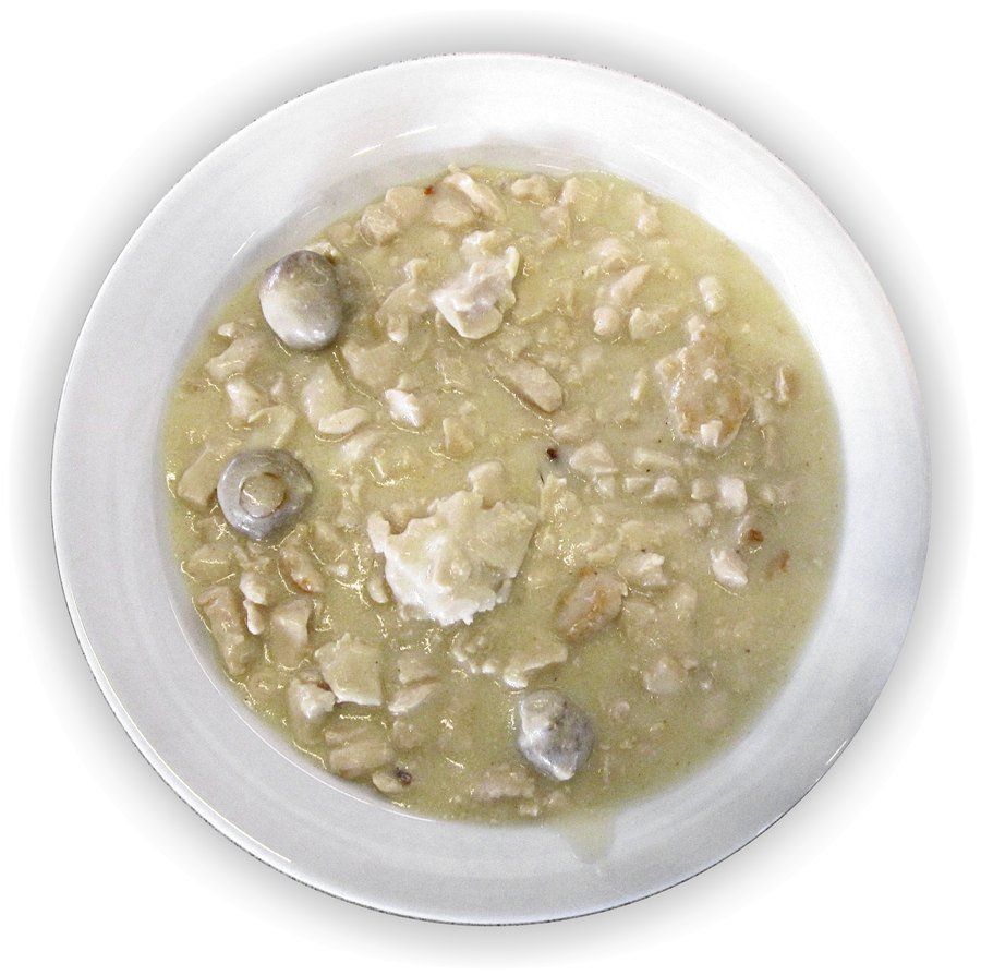 A plate of classic French-style chicken fricassee in a pale creamy sauce with mushrooms